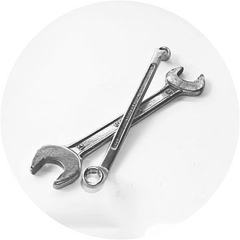 Silver open-end wrenches on top of each other